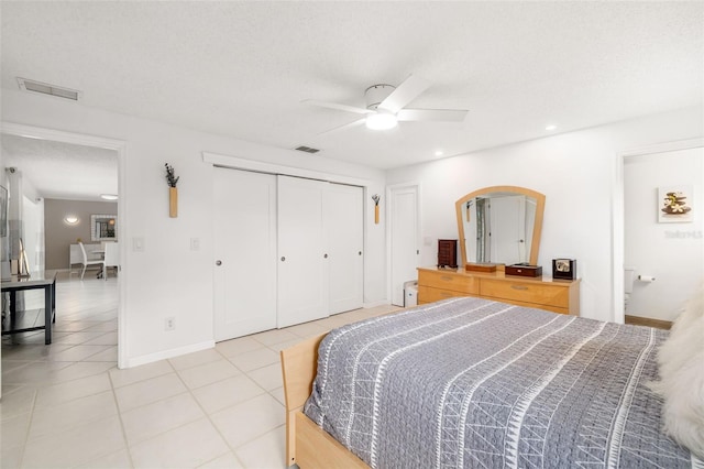 6940 W Country Club Dr N Unit V-77, Sarasota, FL 34243 - bedroom featuring a closet, light tile patterned floors, visible vents, and baseboards