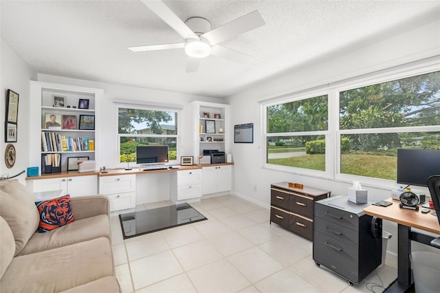 6940 W Country Club Dr N Unit V-77, Sarasota, FL 34243 - home office featuring light tile patterned floors, ceiling fan, a textured ceiling, and a healthy amount of sunlight