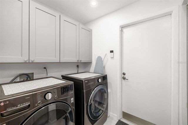 6940 W Country Club Dr N Unit V-77, Sarasota, FL 34243 - laundry room with washing machine and clothes dryer, cabinet space, and recessed lighting