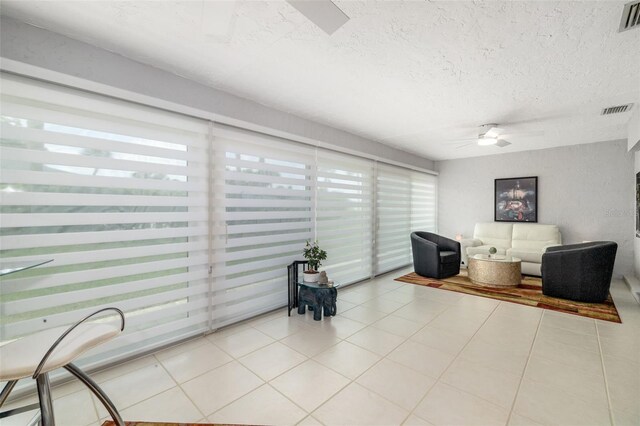 6940 W Country Club Dr N Unit V-77, Sarasota, FL 34243 - tiled living area with visible vents, a textured ceiling, and ceiling fan