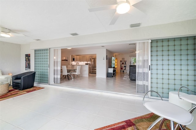 6940 W Country Club Dr N Unit V-77, Sarasota, FL 34243 - view of patio featuring visible vents and ceiling fan