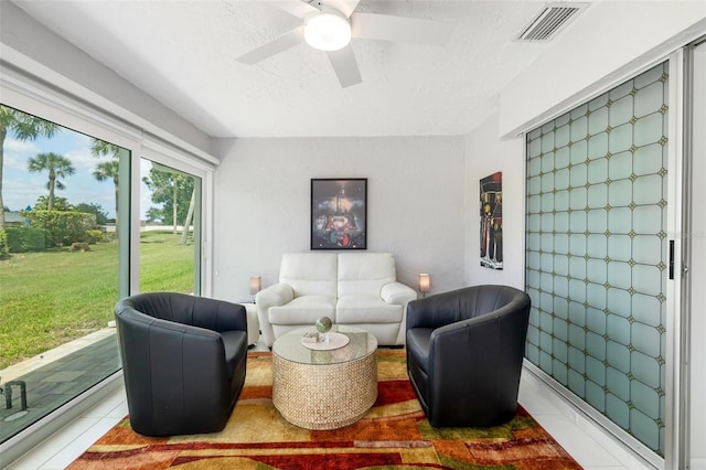 6940 W Country Club Dr N Unit V-77, Sarasota, FL 34243 - interior space featuring visible vents, a textured ceiling, a ceiling fan, and light tile patterned flooring