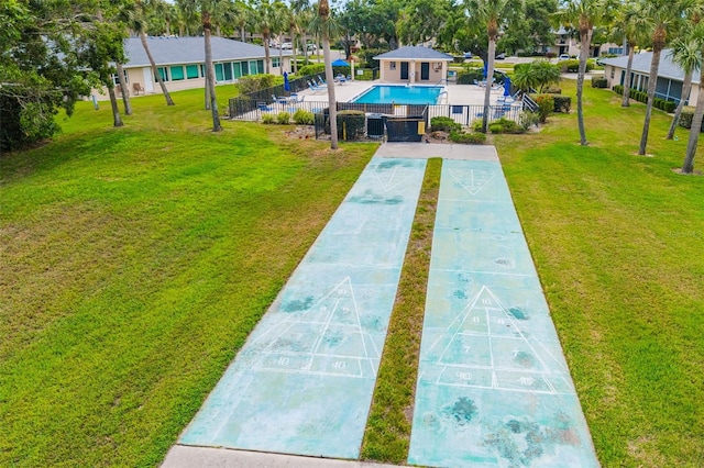 6940 W Country Club Dr N Unit V-77, Sarasota, FL 34243 - view of home's community with a yard, fence, shuffleboard, and a pool
