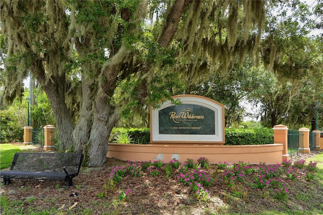 community sign with fence