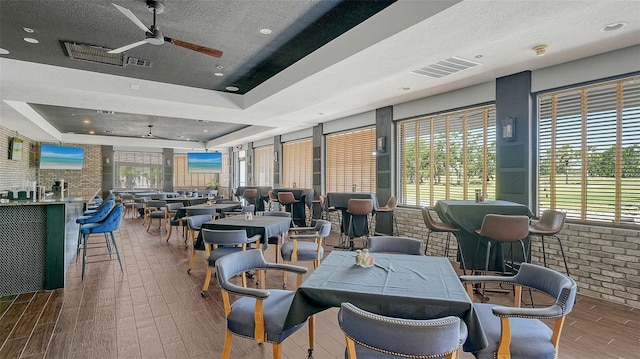 building lobby with a textured ceiling and brick wall