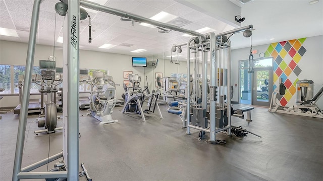 exercise room featuring wallpapered walls