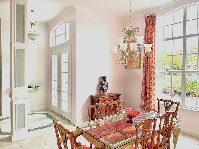 dining room featuring a chandelier, baseboards, light tile patterned flooring, ornamental molding, and french doors