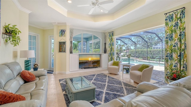 sunroom / solarium featuring an outdoor living space with a fireplace and a ceiling fan