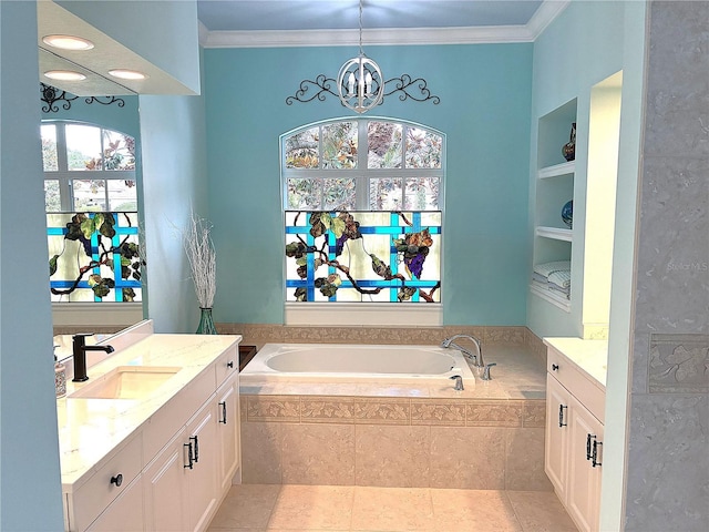 bathroom featuring a bath, vanity, a chandelier, ornamental molding, and built in features