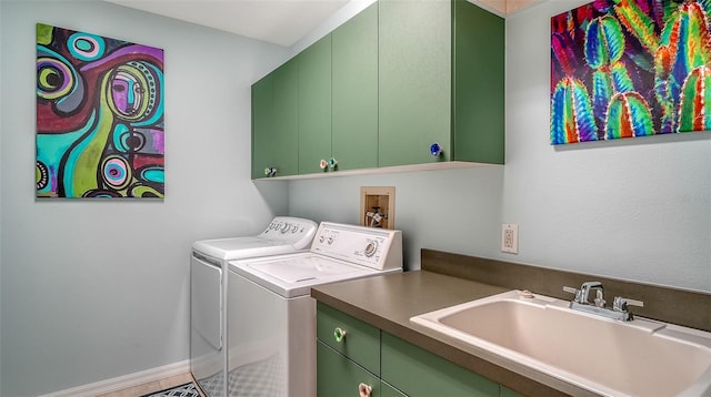 laundry area with separate washer and dryer, cabinet space, and baseboards