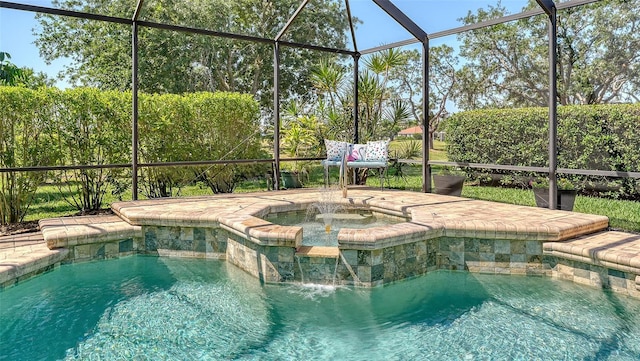 view of pool featuring a pool with connected hot tub and glass enclosure