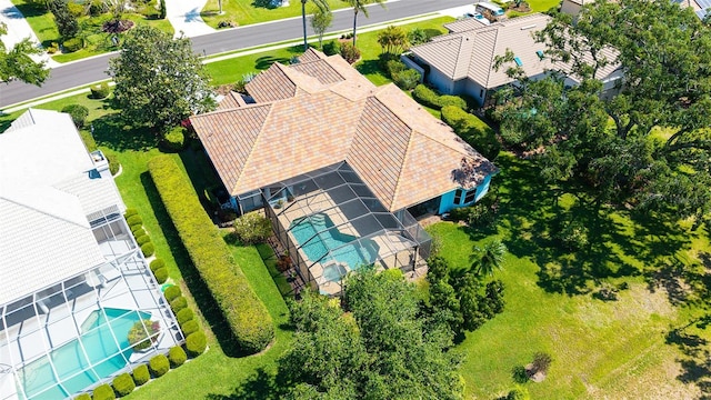 aerial view of property and surrounding area featuring a pool