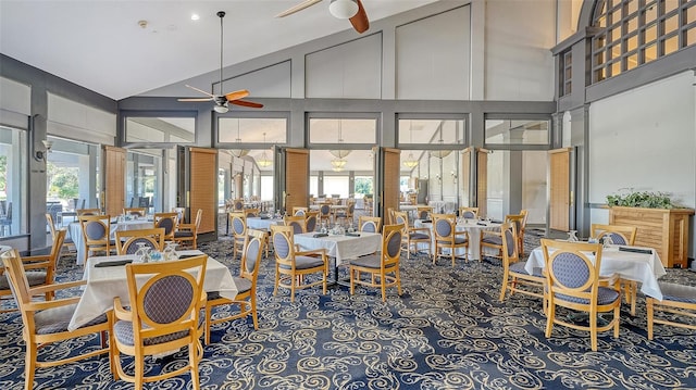 dining area with ceiling fan, high vaulted ceiling, and plenty of natural light