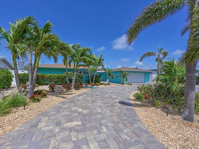 10016 Spoonbill Rd E, Bradenton, FL 34209 - view of front of property with an attached garage and decorative driveway