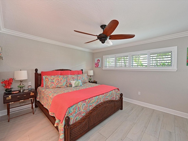 10016 Spoonbill Rd E, Bradenton, FL 34209 - bedroom with light wood-type flooring, ceiling fan, crown molding, and baseboards