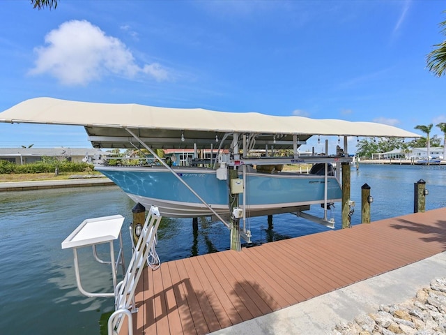 10016 Spoonbill Rd E, Bradenton, FL 34209 - view of dock featuring a water view and boat lift