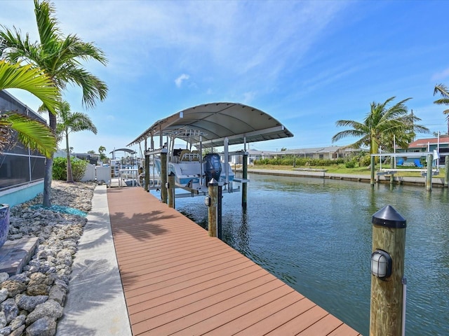 10016 Spoonbill Rd E, Bradenton, FL 34209 - dock area with boat lift and a water view