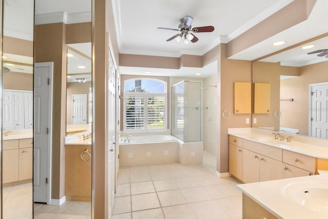 full bath with ceiling fan, a bath, crown molding, a stall shower, and two vanities