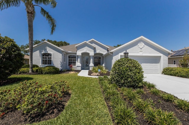 single story home featuring concrete driveway, an attached garage, a front lawn, and stucco siding