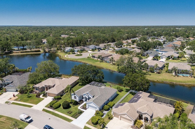 birds eye view of property with a water view and a residential view