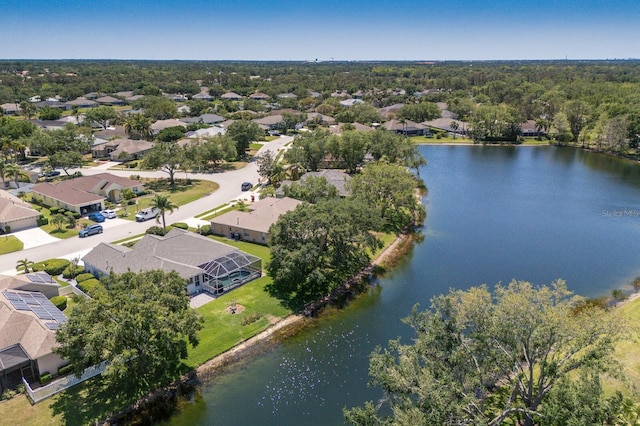 drone / aerial view featuring a water view and a residential view
