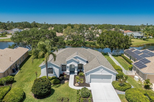 bird's eye view with a water view and a residential view