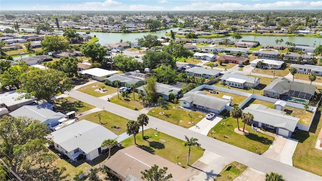 bird's eye view featuring a water view and a residential view