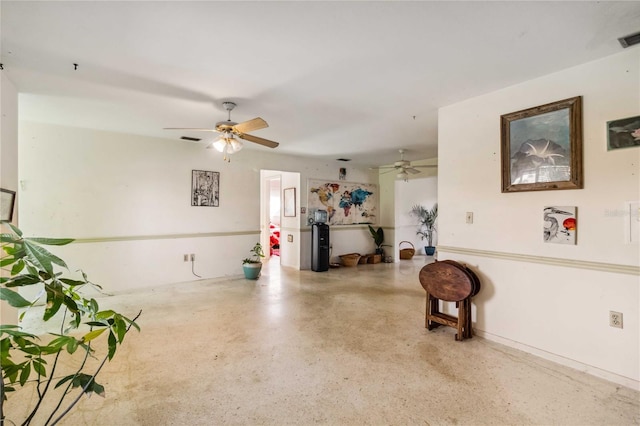 interior space featuring a ceiling fan and visible vents
