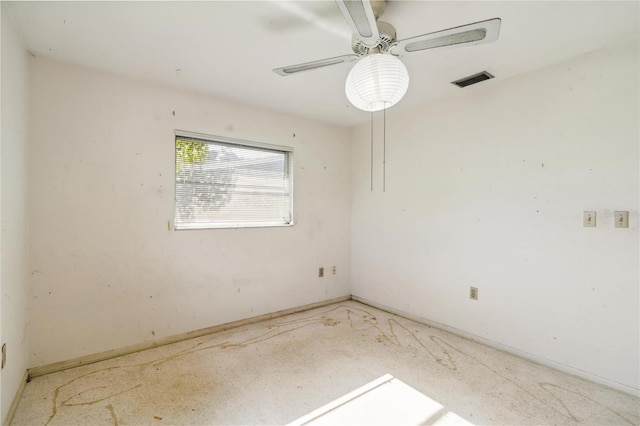 empty room with ceiling fan and visible vents