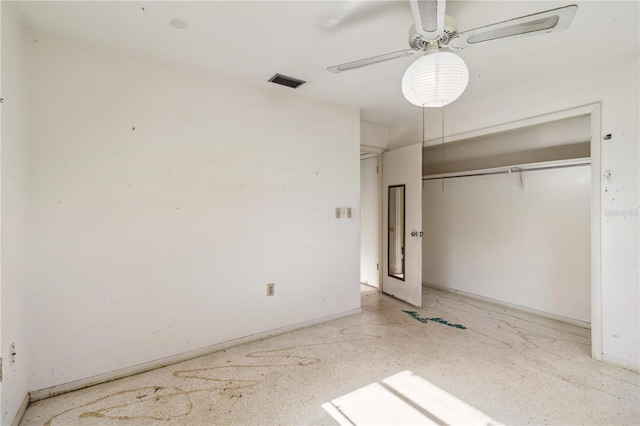 unfurnished bedroom featuring baseboards, ceiling fan, a closet, and visible vents