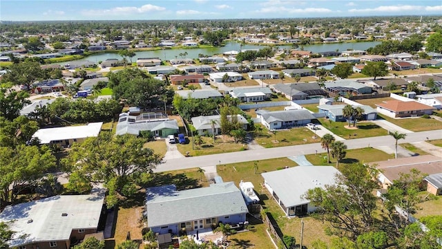 bird's eye view featuring a water view and a residential view