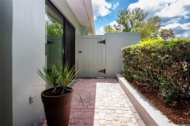 view of patio featuring a gate