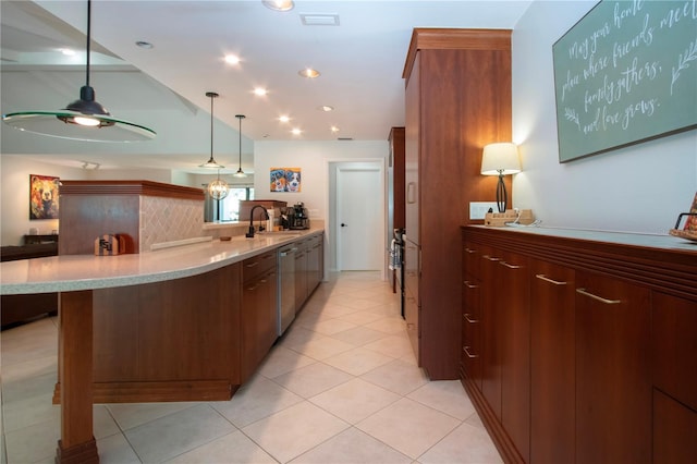 kitchen featuring dishwasher, a peninsula, a sink, pendant lighting, and a ceiling fan
