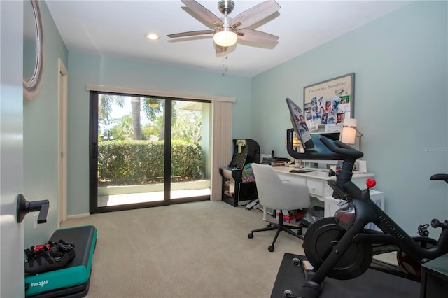carpeted home office with ceiling fan