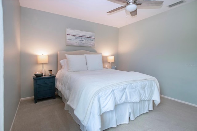 carpeted bedroom with baseboards and a ceiling fan