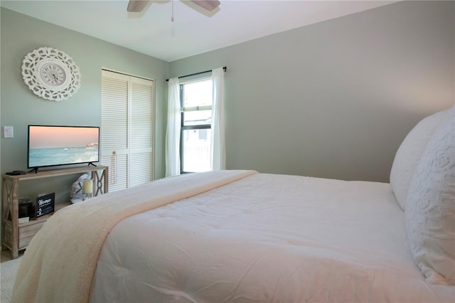 bedroom featuring ceiling fan and a closet
