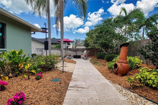 fenced backyard with a patio area
