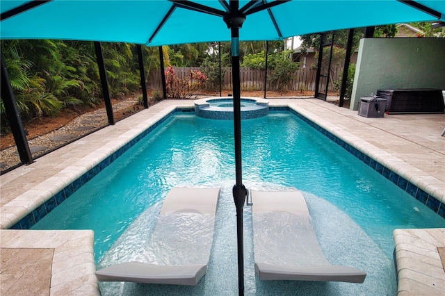 view of swimming pool featuring fence, a patio area, and a pool with connected hot tub