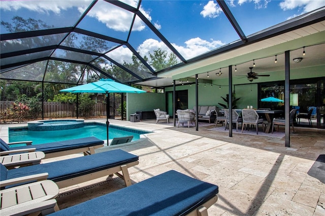 view of pool with a patio, a lanai, and ceiling fan
