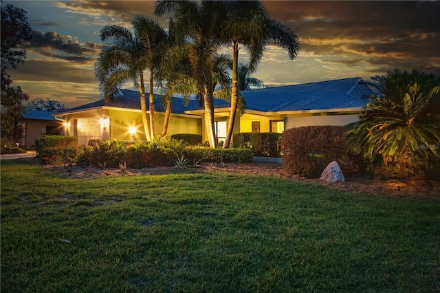 view of front of home with a front lawn and stucco siding
