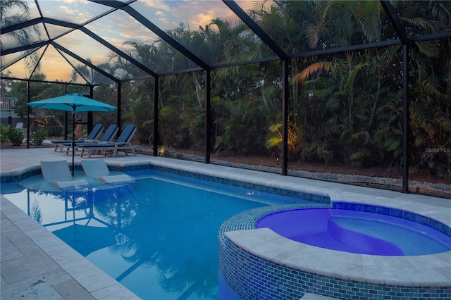 view of swimming pool with a patio, a lanai, and a pool with connected hot tub