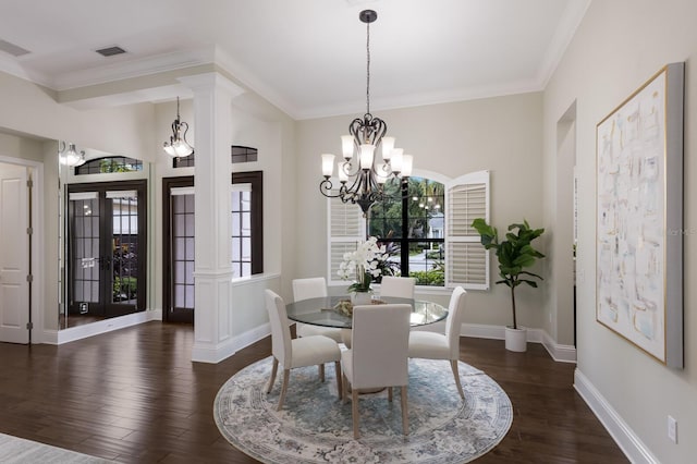 7532 Greystone St, Lakewood Ranch, FL 34202 - dining area featuring dark wood finished floors, baseboards, ornamental molding, and a chandelier