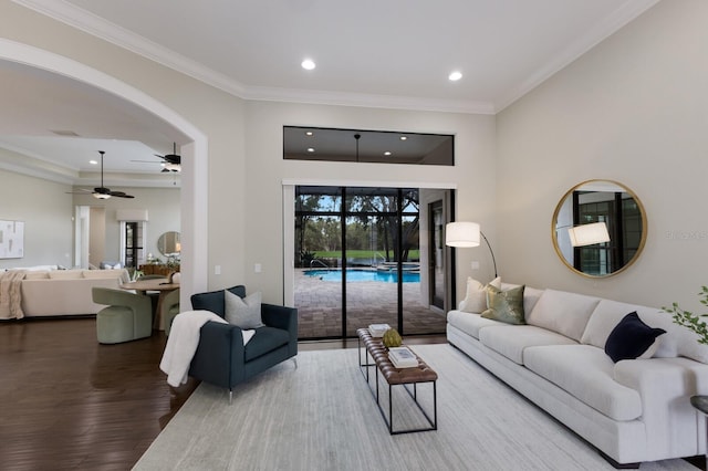 7532 Greystone St, Lakewood Ranch, FL 34202 - living area featuring ceiling fan, recessed lighting, wood finished floors, ornamental molding, and arched walkways