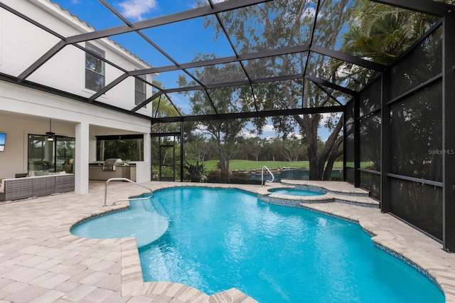 7532 Greystone St, Lakewood Ranch, FL 34202 - view of pool with area for grilling, a patio area, a pool with connected hot tub, and a lanai