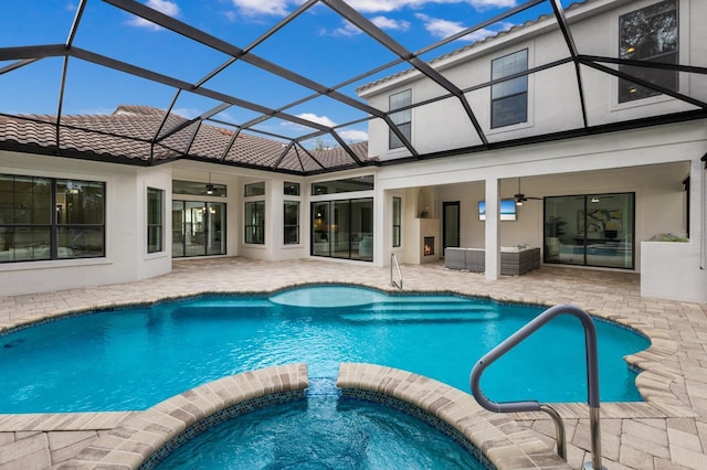 7532 Greystone St, Lakewood Ranch, FL 34202 - view of pool featuring ceiling fan, a patio area, a pool with connected hot tub, glass enclosure, and an outdoor hangout area