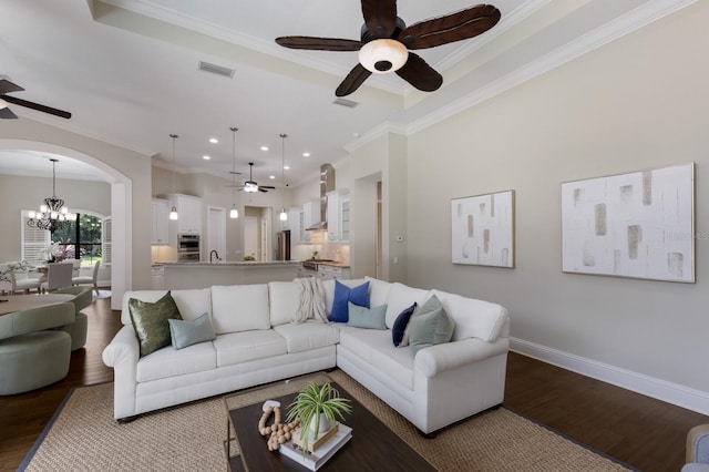 7532 Greystone St, Lakewood Ranch, FL 34202 - living area with ceiling fan, arched walkways, wood finished floors, crown molding, and a chandelier