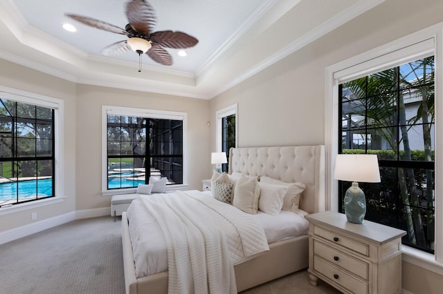 7532 Greystone St, Lakewood Ranch, FL 34202 - bedroom featuring a tray ceiling, light carpet, ornamental molding, recessed lighting, and baseboards