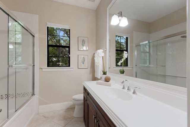 7532 Greystone St, Lakewood Ranch, FL 34202 - full bath with vanity, toilet, baseboards, and combined bath / shower with glass door