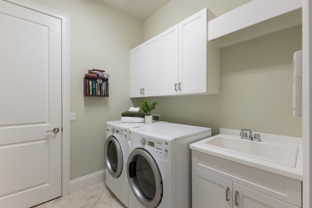 7532 Greystone St, Lakewood Ranch, FL 34202 - laundry area with washer and clothes dryer, cabinet space, light tile patterned flooring, and baseboards