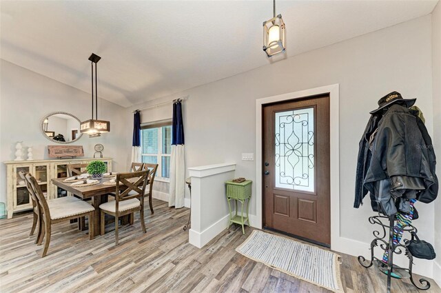 1103 134th St E, Bradenton, FL 34212 - foyer featuring light wood-style floors, baseboards, and a chandelier